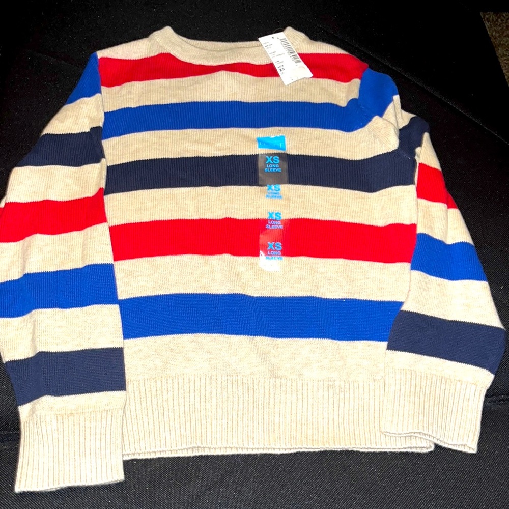 NWT- Boys XS(4) Children’s Place Striped Sweater. Colors are cream, red, & blue.